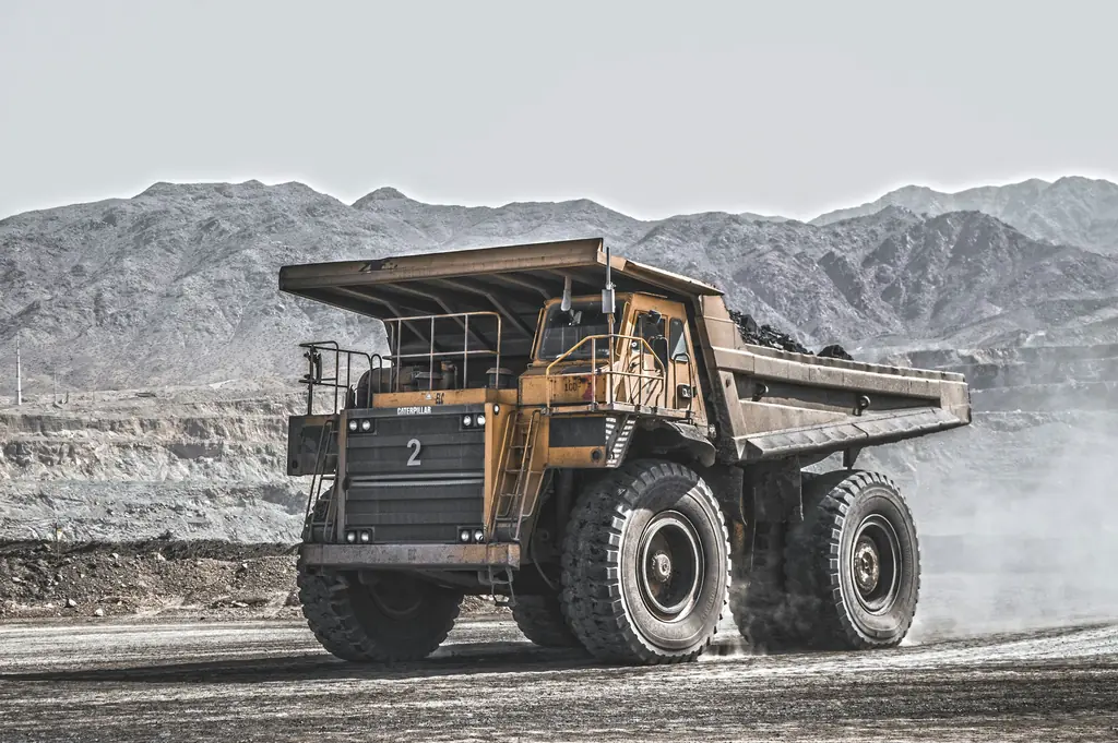 A haul truck on an open cut mine road