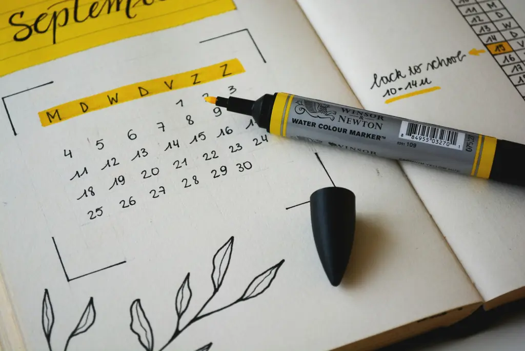 A monthly calendar drawn in a notebook with a marker pen