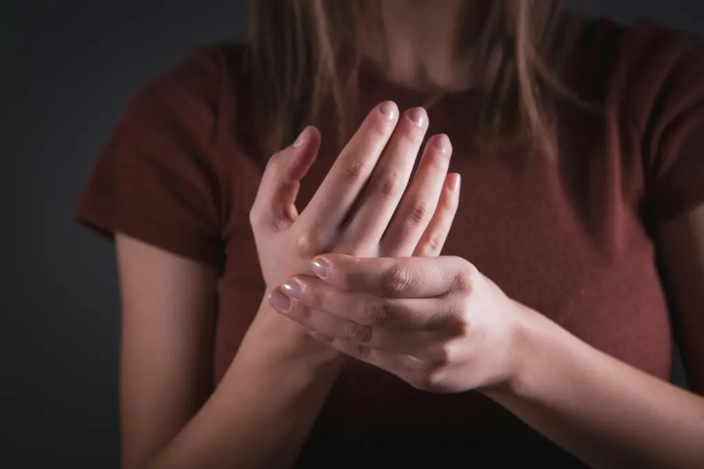 A person holding their wrist